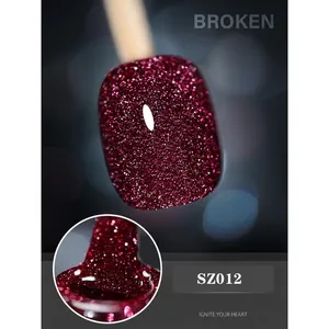 Macro shot of sparkling wine red diamond gel nail polish with reflective glitter SZ012