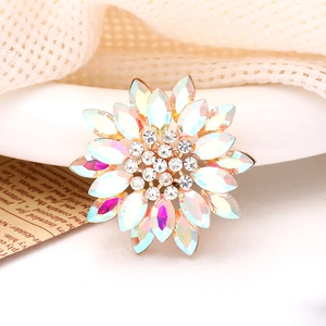 Macro detail of sun flower alloy accessory with iridescent petals and clear rhinestones