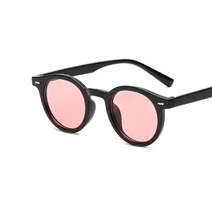 Retro small round frame sunglasses with pink lenses and silver rivet accents