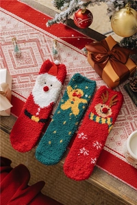 Cozy Christmas coral fleece floor socks with festive Santa and gingerbread patterns