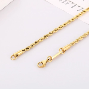 Close-up of golden stainless steel rope chain with a lobster clasp and woven texture