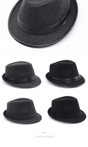 Detail of wool felt fabric and decorative bands on black and dark grey fedora hats