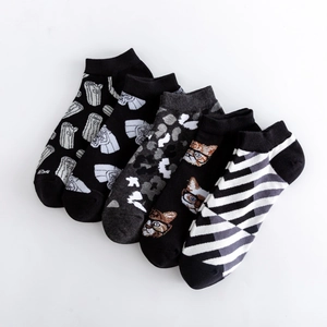 Five pairs of men's casual cotton crew socks featuring diverse animal and camo patterns