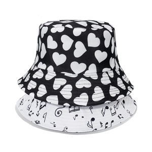 Stack of casual bucket hats with heart and musical note prints for women's summer style
