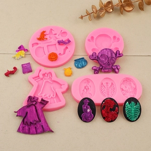 Detailed pink silicone molds featuring Halloween skull, wizard, and pumpkin motifs for DIY baking