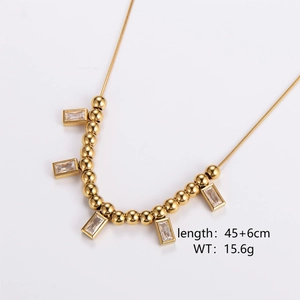Detailed view of a gold beaded necklace featuring five rectangular zircon stone pendants