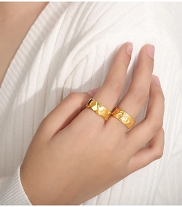 Detailed view of vintage gold plated rings with wave texture and cloud engraving