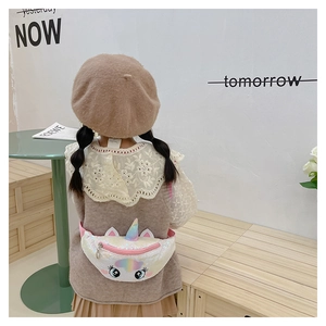 Kid wearing a sequin unicorn waist bag with colorful ears and pink adjustable strap