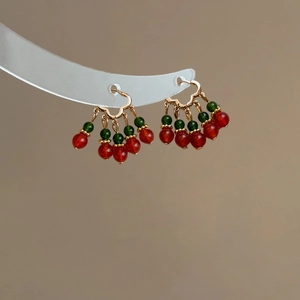 Ethnic style heart tassel earrings with red beads and green crystals in gold finish