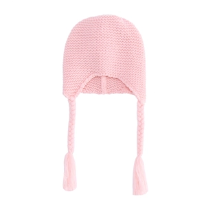 Detail of pink knitted baby hat featuring earflaps and long braided tassels design