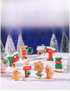 Miniature resin Christmas road signs and gingerbread man ornaments for DIY festive decor