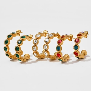 Vintage style C-shaped textured gold earrings with emerald and colorful crystal accents