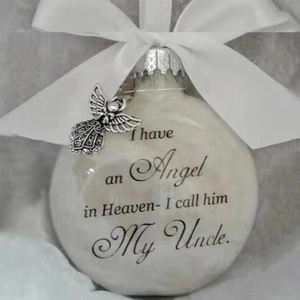 Memorial Christmas ball ornament with white feathers and My Uncle engraving on the surface