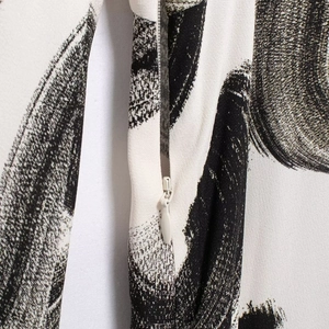 Elegant Zen-style long sleeve maxi dress with black and white brushstroke print