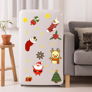 Christmas wall stickers with Santa, reindeer and tree on white furniture in home setting