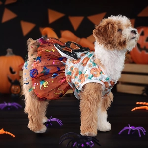 Close-up of Halloween pet dress with orange tulle skirt and pumpkin printed bodice