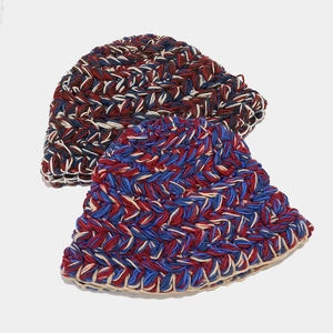 Close-up of thick chunky knit texture on vintage-style multi-color bucket hats