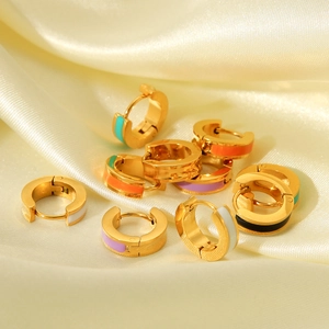 Detail of colorful enamel hoop earrings in 18K gold finish on champagne silk background