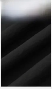 Close-up of black anti-static fabric with fine twill texture for loose sweatpants