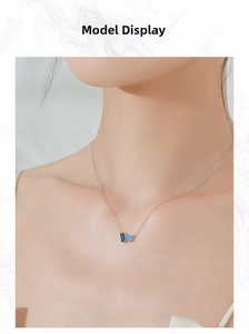 Model wearing S925 sterling silver necklace with blue sapphire rectangle pendant