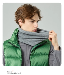 Detail of gray knitted neck warmer showing soft texture and cozy warmth on a model