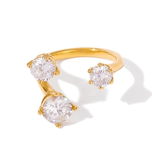 Luxurious 18K gold plated titanium steel ring with three cubic zirconia stones in a claw setting
