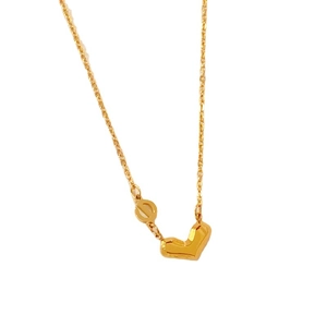 Polished gold heart pendant necklace in titanium steel with a minimalist fine link chain