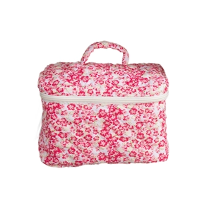 Quilted floral makeup bag with top handle and zipper closure on a white background