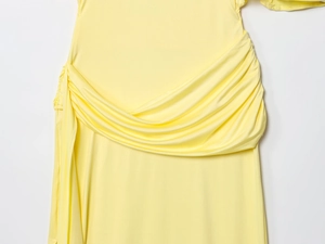 Detail of elegant backless yellow maxi dress showing draped pleats and fabric texture