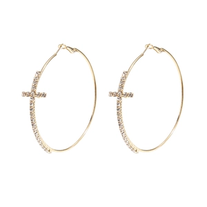 Golden hoop earrings featuring rhinestone-encrusted cross charms on a white background