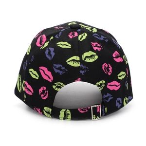 Detail of black baseball cap with vibrant lip prints and metal buckle closure