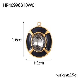 Detail of golden enamel oval pendant with grey zircon, measuring 1.6cm by 1.2cm