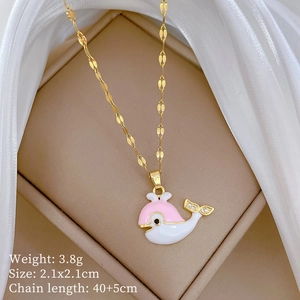 Detail of pink enamel whale pendant on gold titanium steel chain with zirconia stones
