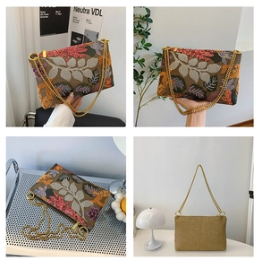 Detailed close-up of intricate floral embroidery on a brown fabric shoulder bag with gold chain