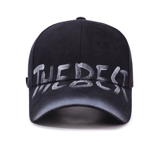 Distressed black baseball cap with white THE BEST graffiti print and street style