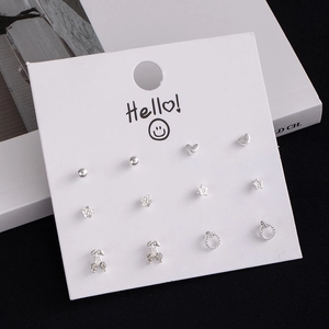 Detailed set of 12 silver stud earrings with heart, star, and crystal cherry designs