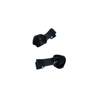 Pair of elegant black ribbon hair clips with rosebud knots for ballet-style hair styling