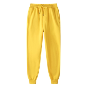 Bright yellow thermal sports sweatpants with drawstring waist and ribbed ankle cuffs