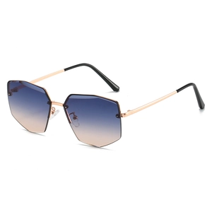 Modern rimless geometric sunglasses with blue to orange gradient lenses and gold metal frame