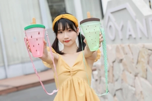 Fruit-themed plastic straw cups with watermelon and kiwi patterns and shoulder straps