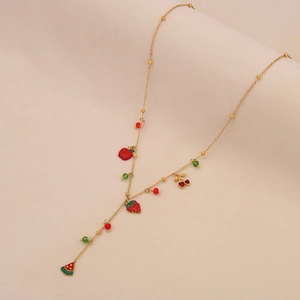 Detail of gold Y-necklace featuring enamel cherry, strawberry and watermelon fruit charms