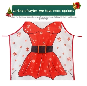 Detail view of festive Christmas apron with red dress design and white snowflake patterns
