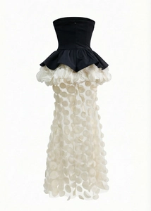 Detail of 3D petal appliques on semi-transparent white mesh of a fishtail dress