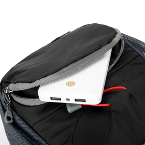 Detail of waterproof black nylon waist bag with USB charging port and zipper feature