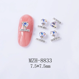 Macro detail of heart-shaped nail art charm with silver accents and 7.5mm dimensions