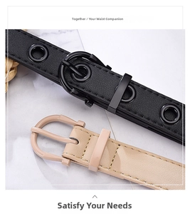 Detail of two belts with pin buckles featuring eyelet hollow decoration and minimalist style