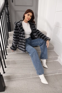 Detailed texture of grey and black striped faux fur coat with soft hooded design
