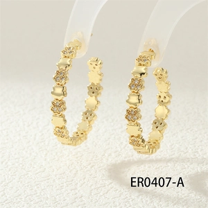 Macro detail of gold chain-link earrings with zircon flower inlay on transparent stand