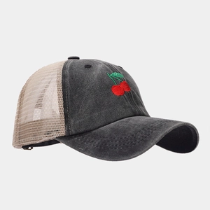 Detail of cherry embroidery on distressed dark gray denim trucker hat with mesh back