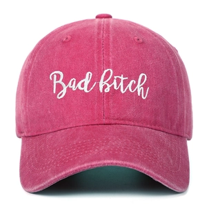 Retro washed cotton pink baseball cap with white Bad Bitch embroidery and curved brim